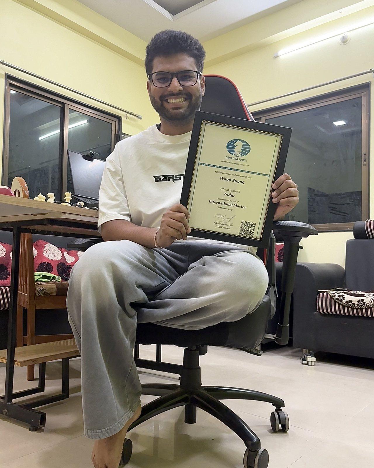 Suyog Wagh holding his FIDE International Master title certificate
